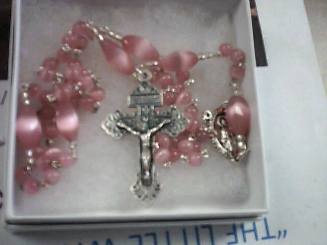 Rosary with pink beads and Our Lady of Grace center