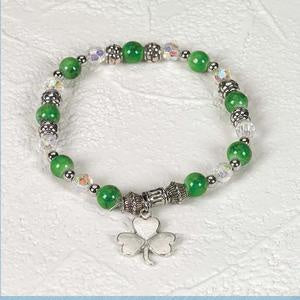 Green and White Beaded Saint Stretch Bracelet with Silver Toned beads and decorative Shamrock Charm Packaged with Prayer Card