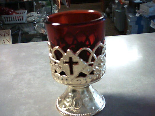 Red glass votive candle holder encased in gold for memorial devotion