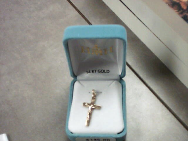 Crucifix medal in 14 kt gold with 14 kt jump ring