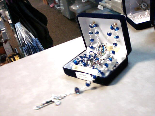 Dark Blue Catseye rosary with Roses on Our Father beads