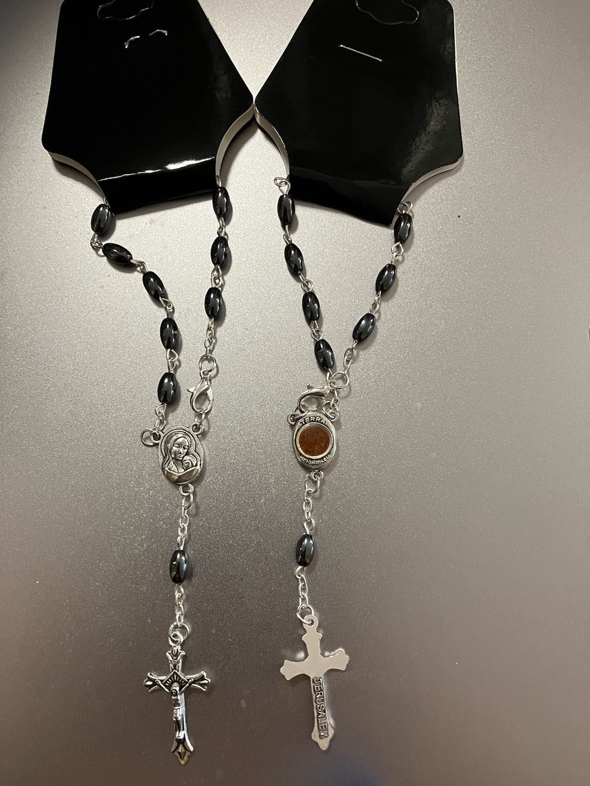 Hematite Bead Auto Rosary With Center Piece Containing Soil From The Holy Land