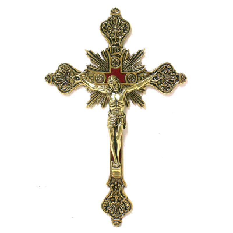 Crucifix in gold tone with red center background